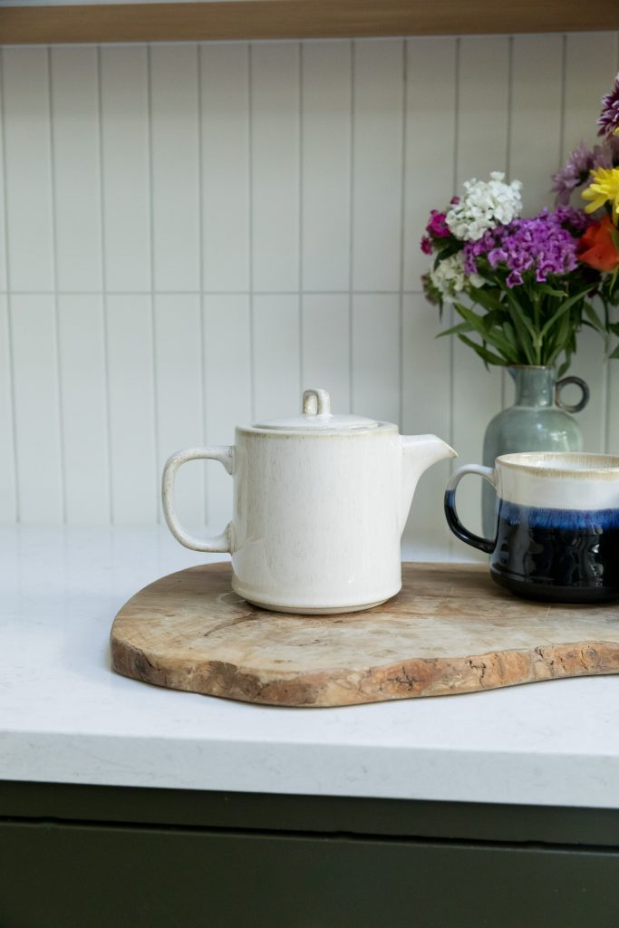 Christmas Gifts | Upper Street Home Cream ceramic teapot on a wooden board