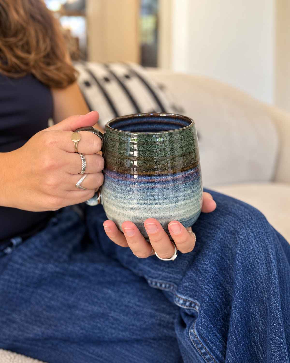 Ceramic Coffee Mugs: Why No Two Reactive Glaze Mugs Are the Same, and How to Choose Yours | Upper Street Home Hand holding a green and blue reactive glaze ceramic mug